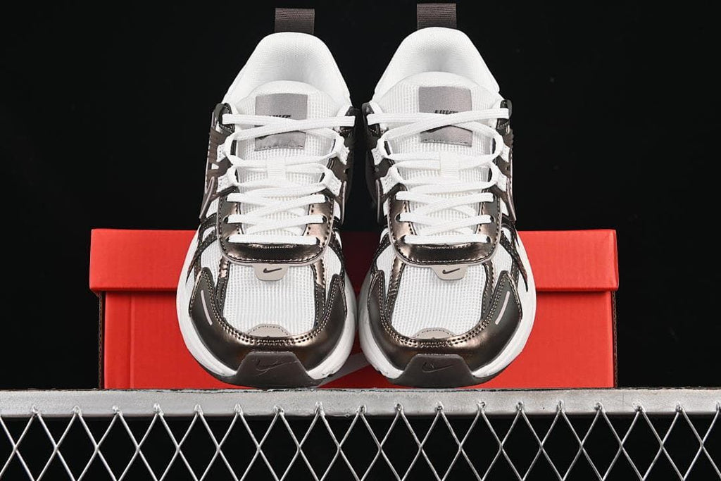 Front view of the pair displayed on a red shoe box