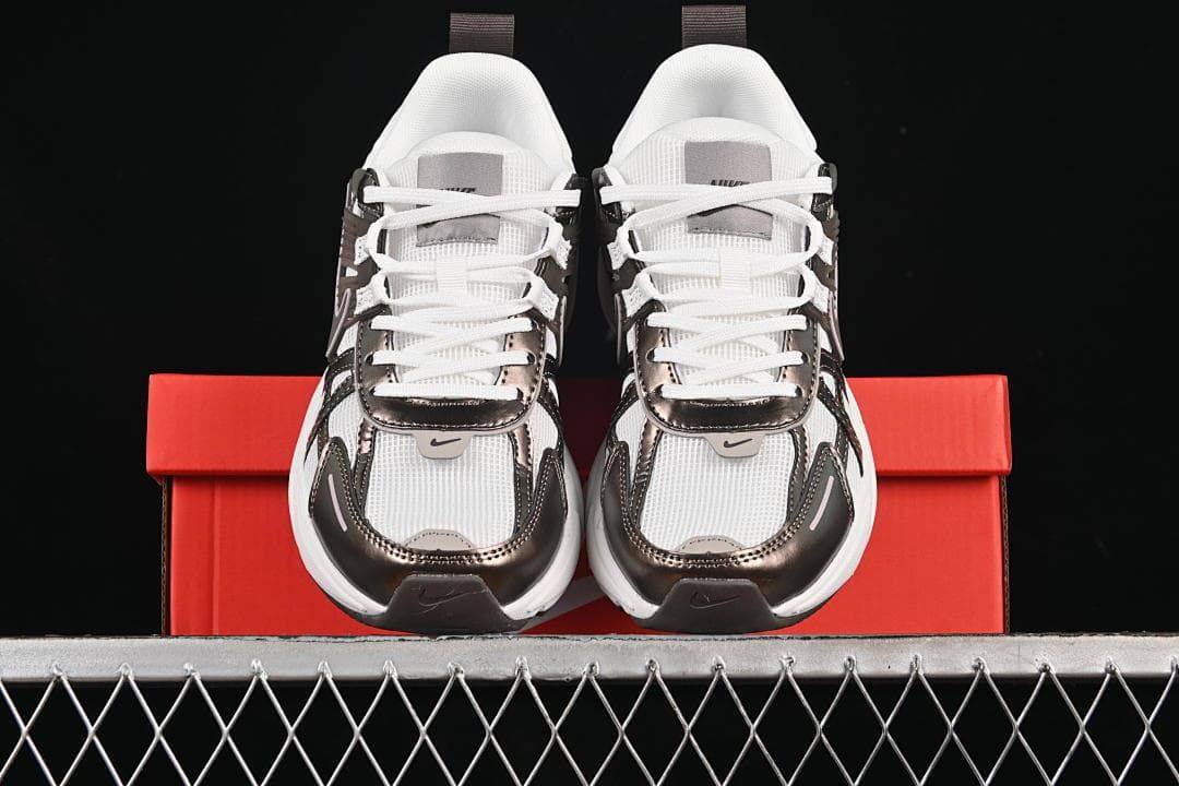 Front view of the pair displayed on a red shoe box