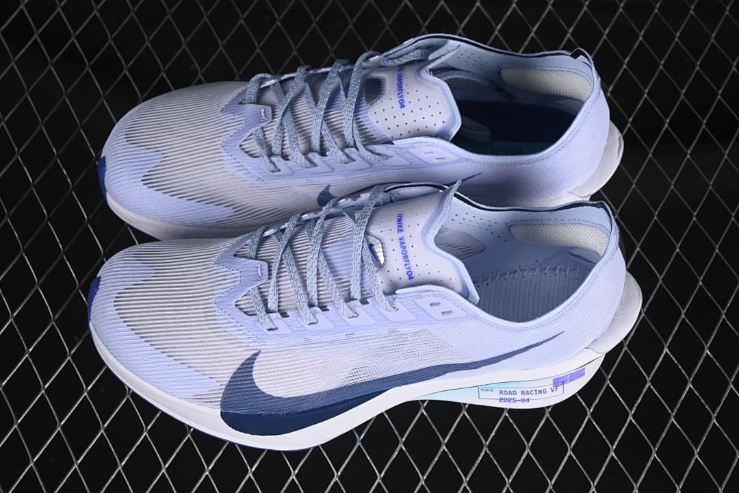 Pair of light grey and blue road shoes shown from above and the side.