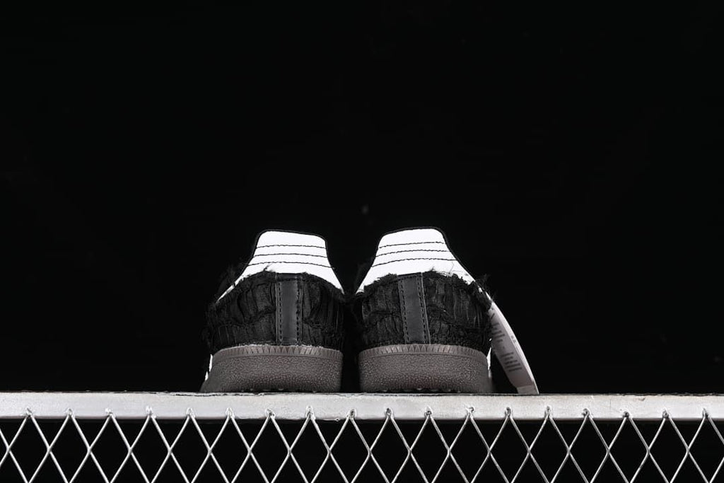 Rear view of both sneakers showing contrasting heel tabs