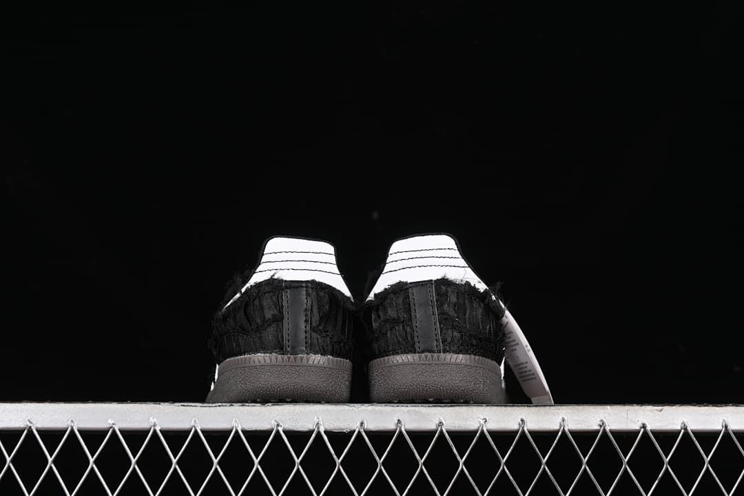 Rear view of both sneakers showing contrasting heel tabs