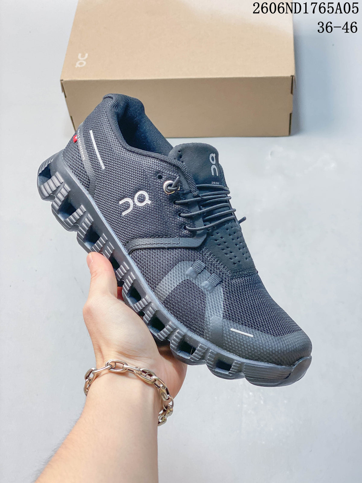 Charcoal gray On Cloud 5 sneaker with elastic laces and a segmented outsole.