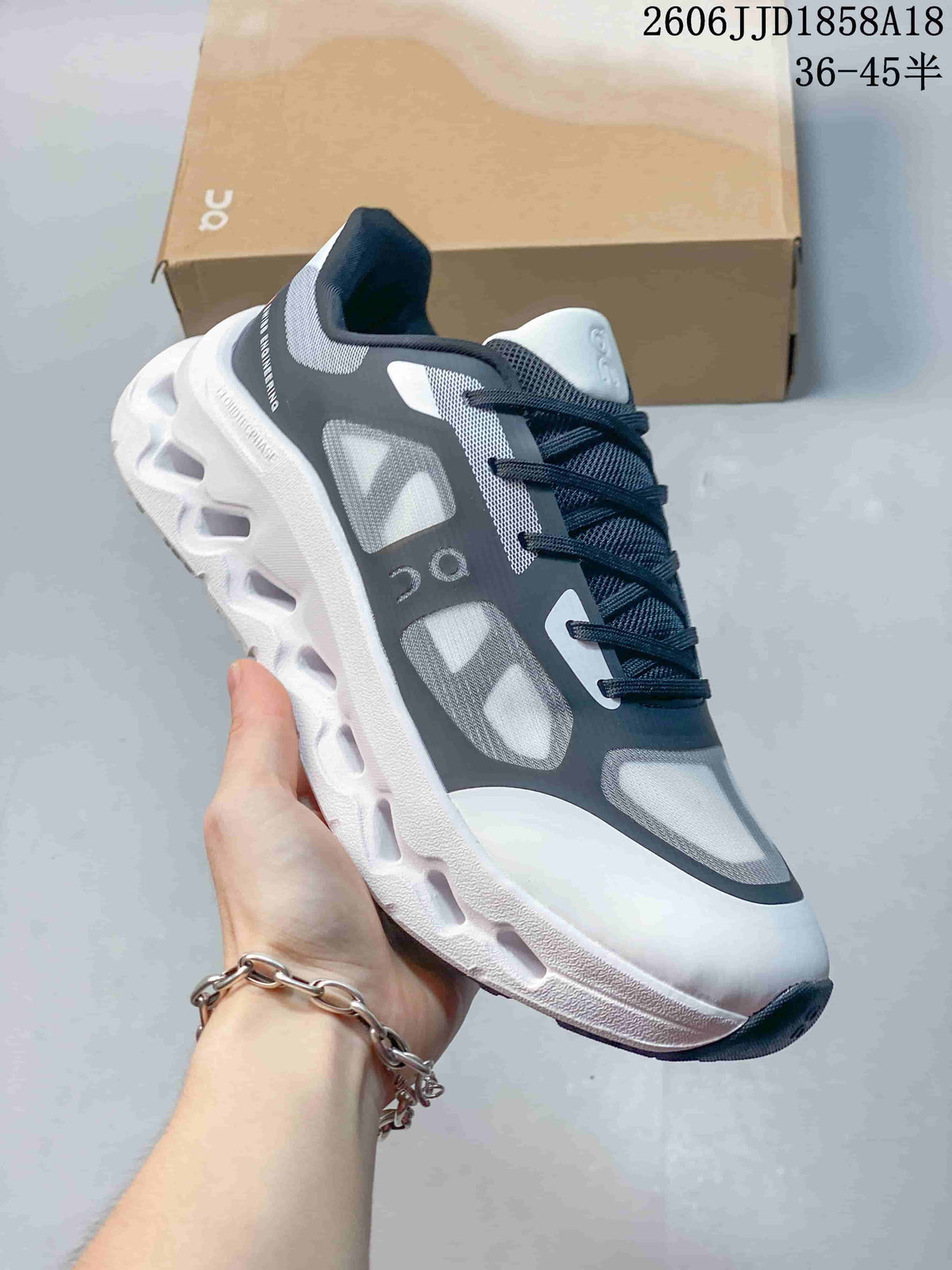 Angled side view of the sneaker with dark laces and a sculpted white sole.