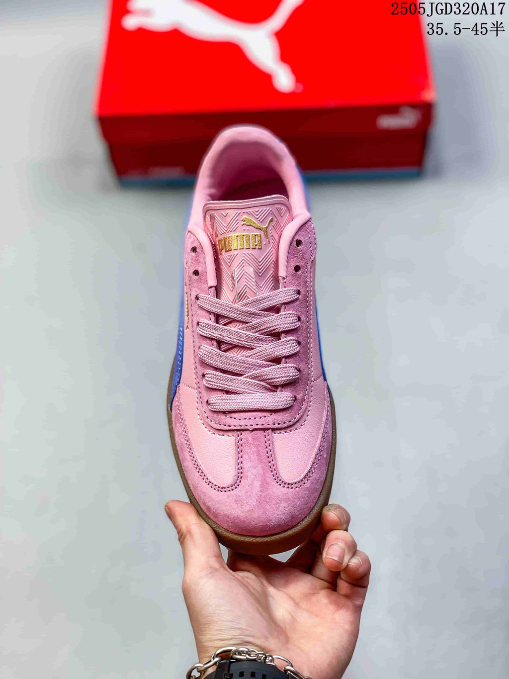 Top view of a pink lace-up PUMA sneaker showing its T-toe design and patterned tongue
