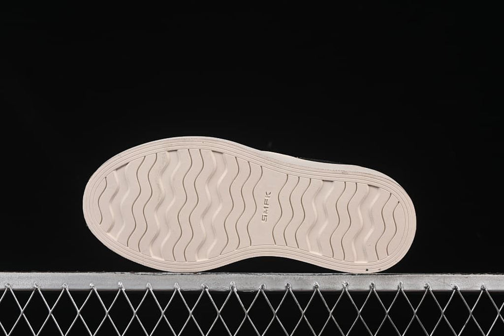 Underside view showing the patterned outsole and SMFK marking.
