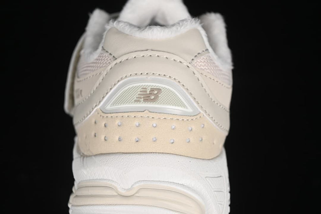 Rear view showing the heel panel, logo detail, and thick white sole