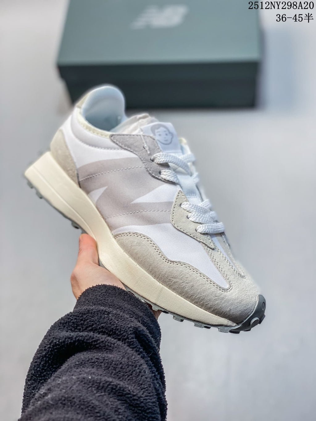 New Balance 327-style sneaker in pale gray and white with an oversized side logo