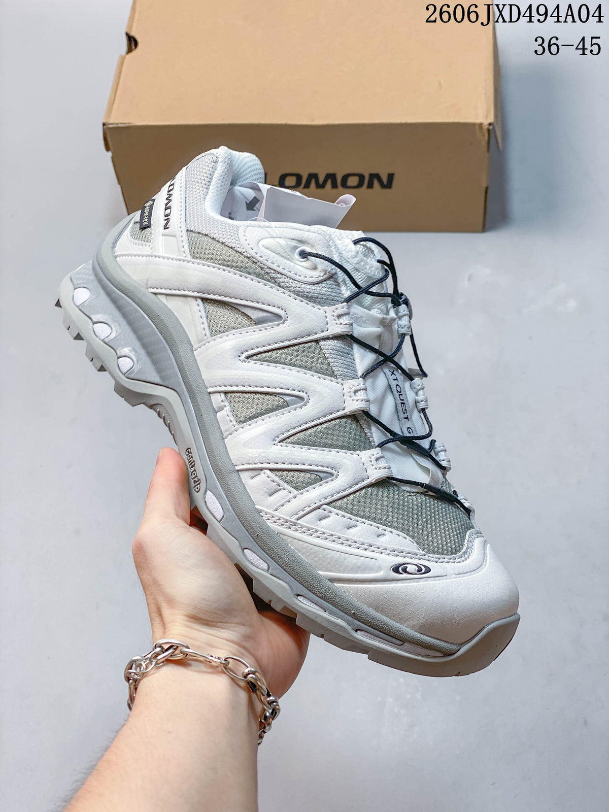 Side view of a white and gray Salomon XA Pro 3D sneaker.