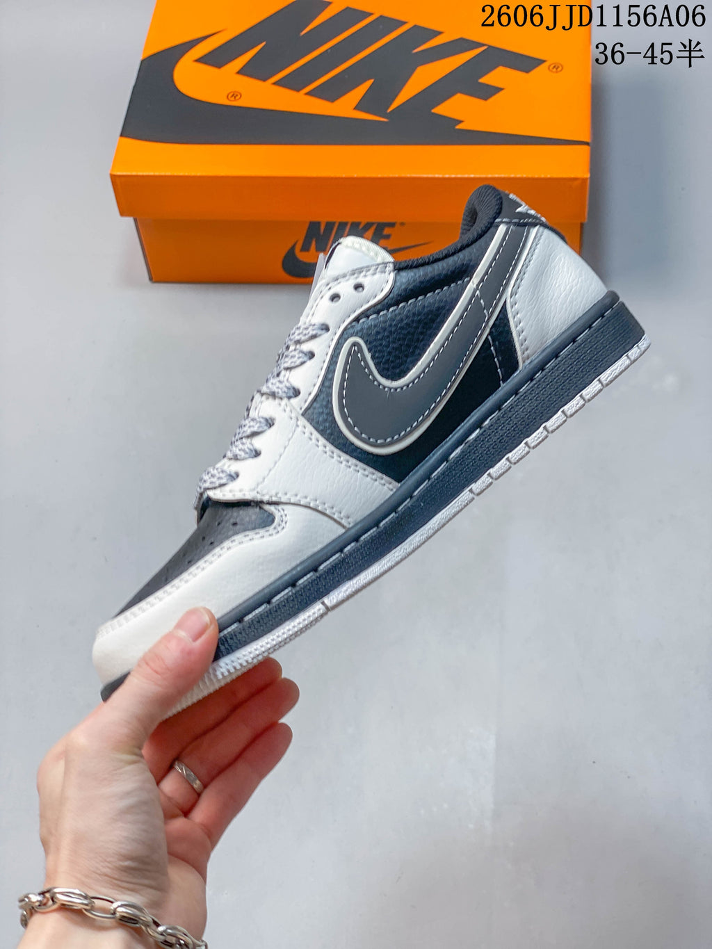 Side view of the low-top sneaker with gray overlays and a white midsole