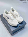 Pair of white Descente Run Step sneakers displayed on a branded box.