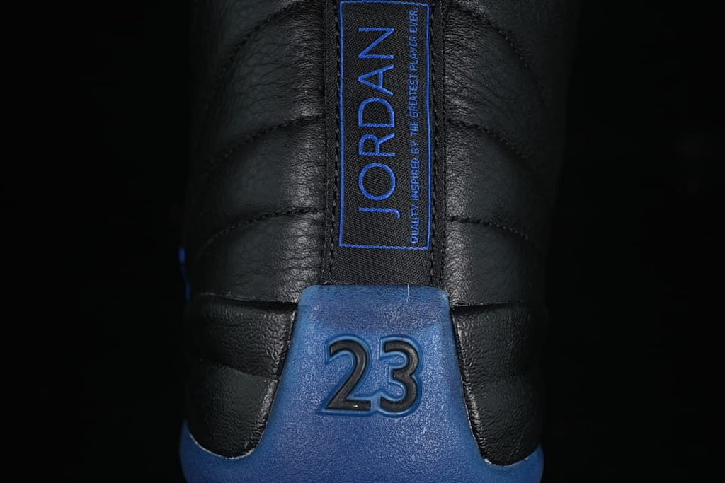 Rear view showing blue heel details and the number 23