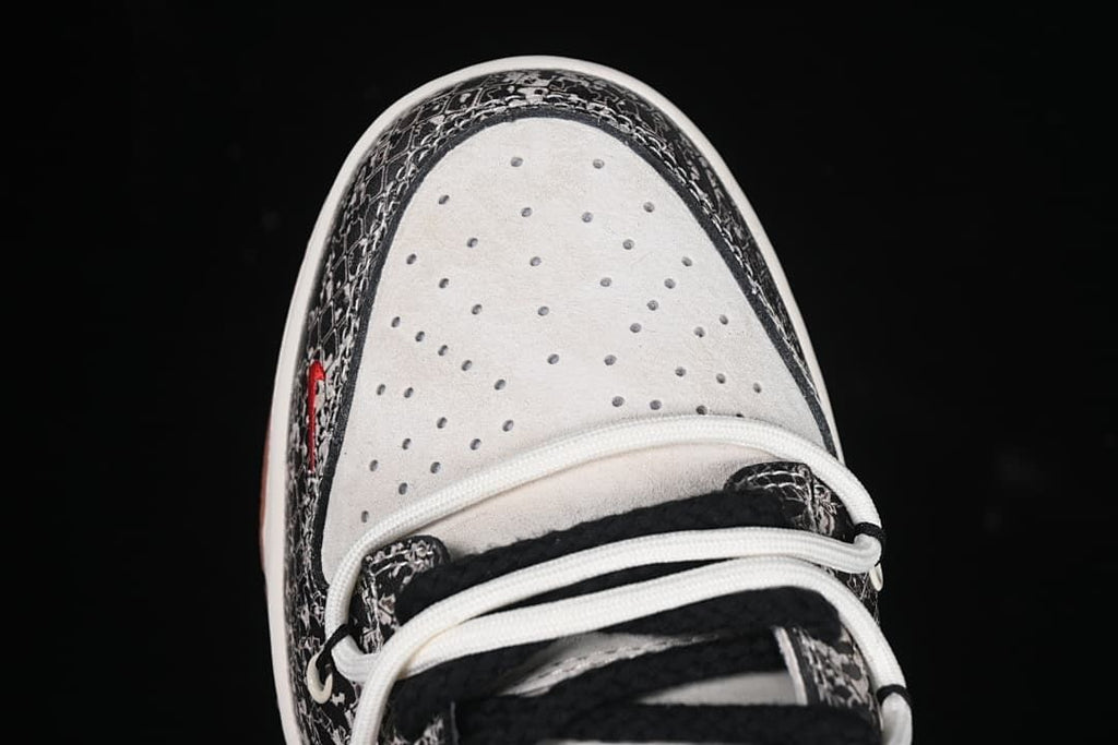 Top view of the perforated white toe box and patterned trim