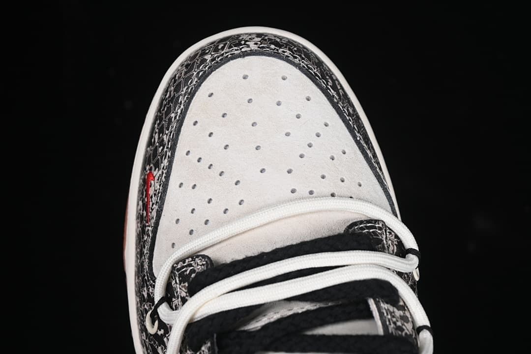 Top view of the perforated white toe box and patterned trim
