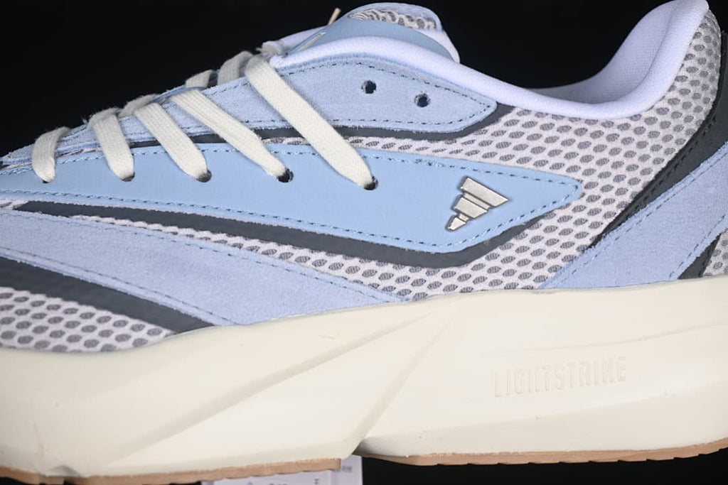 Detail of the layered upper, side logo, and midsole branding