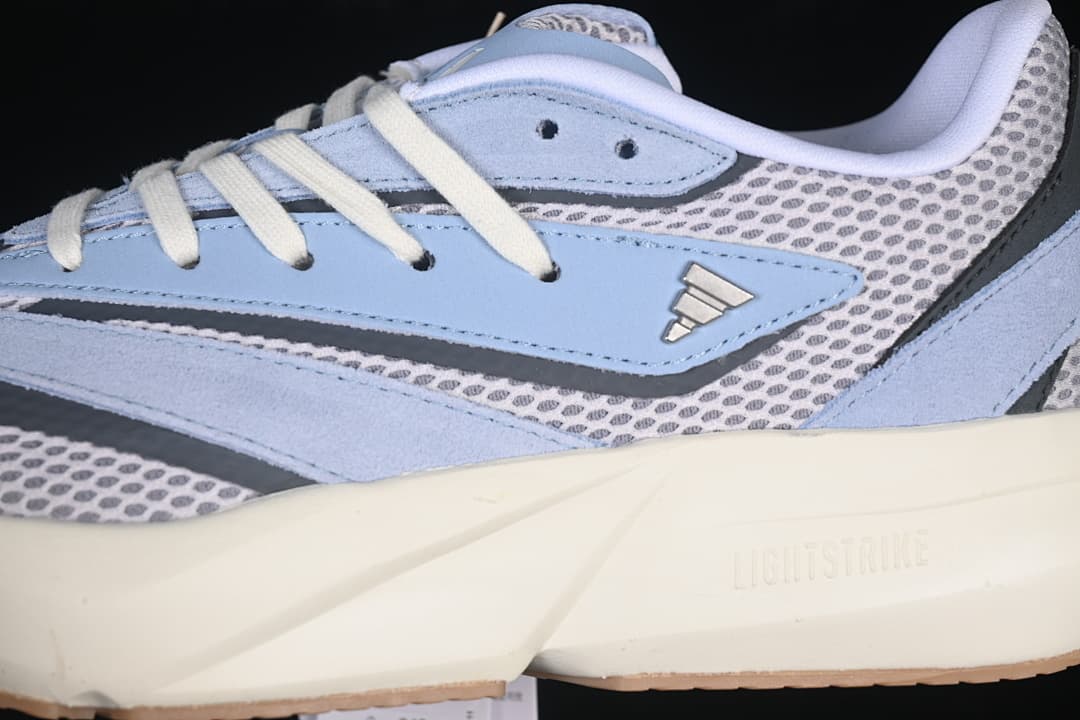 Detail of the layered upper, side logo, and midsole branding