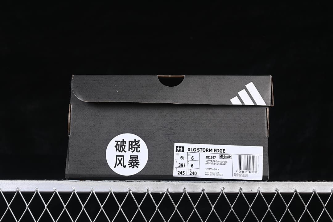 Shoe box label identifying XLG Storm Edge, style JQ1667, and the photographed sample size.