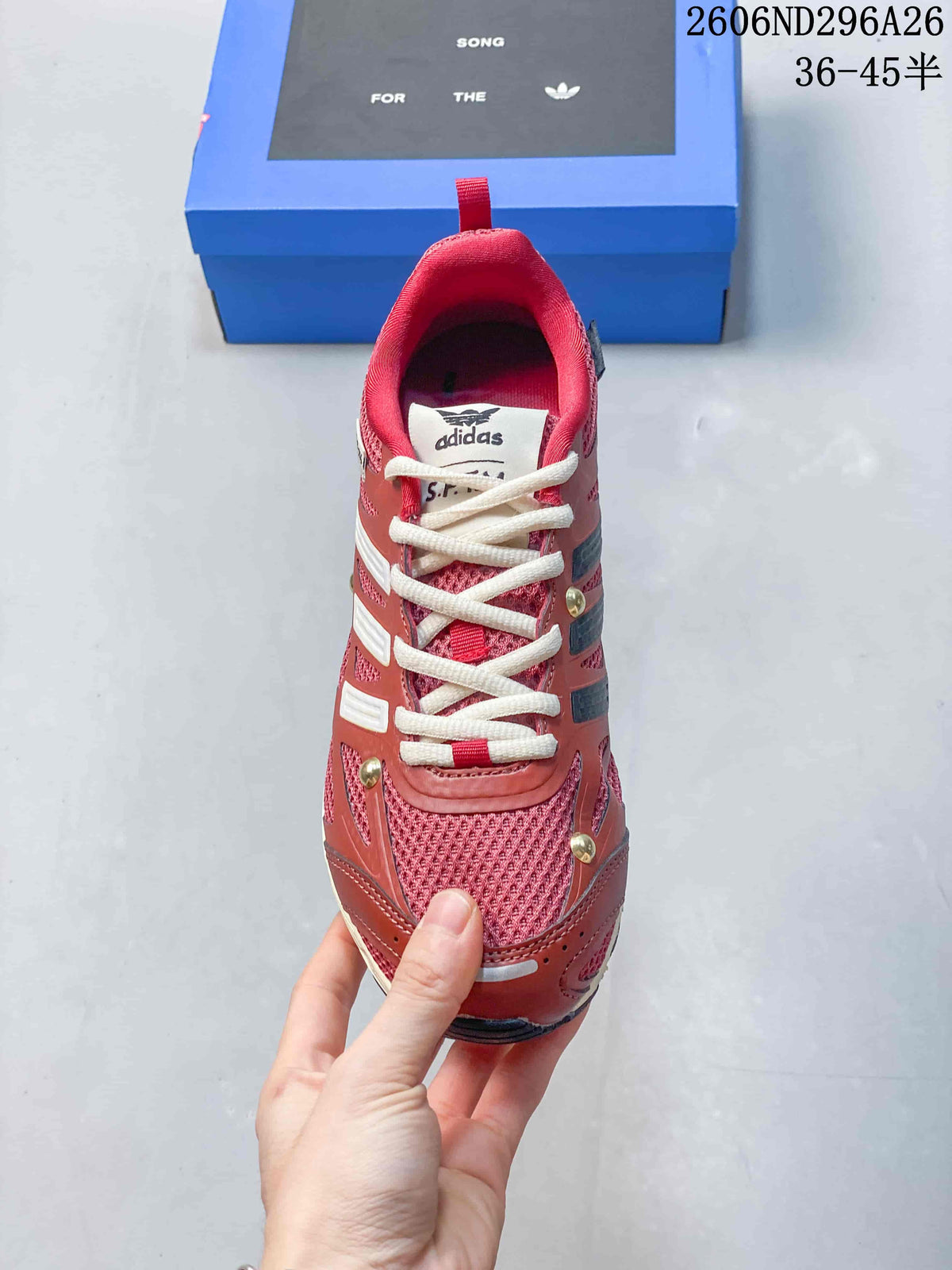 Top view of a red lace-up sneaker with cream laces