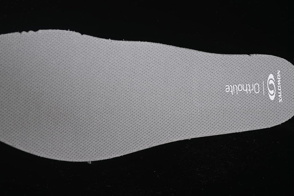 Close-up of the removable insole with Salomon and Ortholite markings