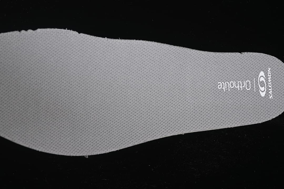 Close-up of the removable insole with Salomon and Ortholite markings