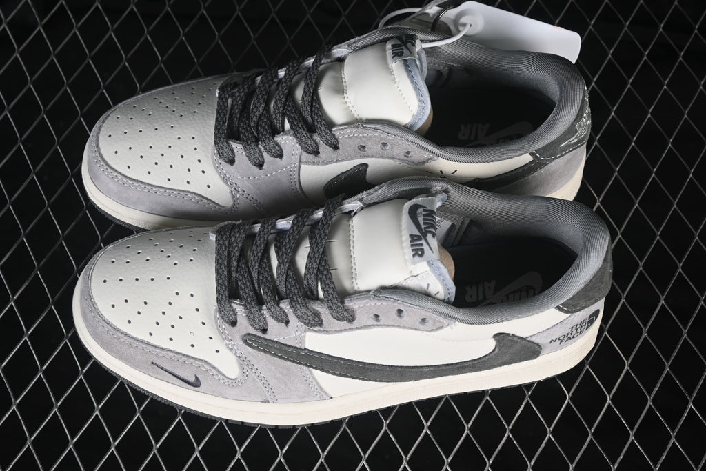 Pair of white and grey low-top sneakers viewed from above, showing perforated toe boxes, dark laces, and contrasting side panels.