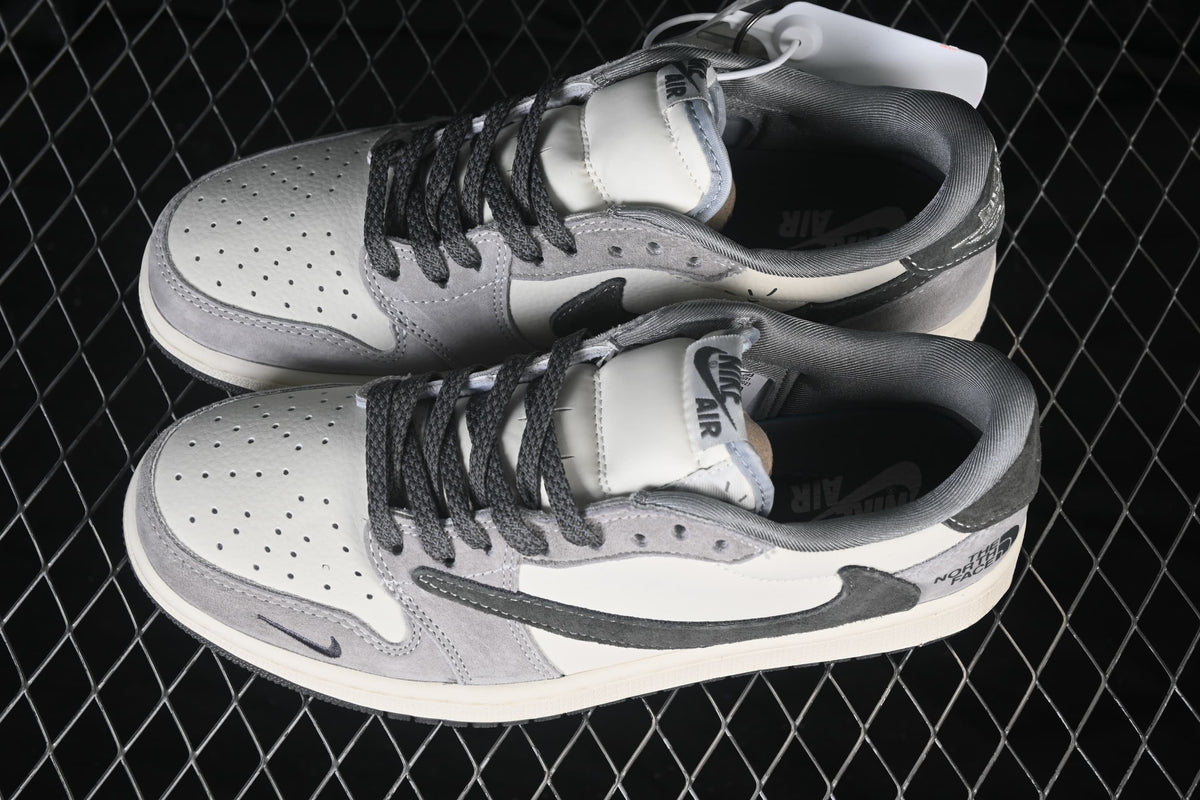 Pair of white and grey low-top sneakers viewed from above, showing perforated toe boxes, dark laces, and contrasting side panels.