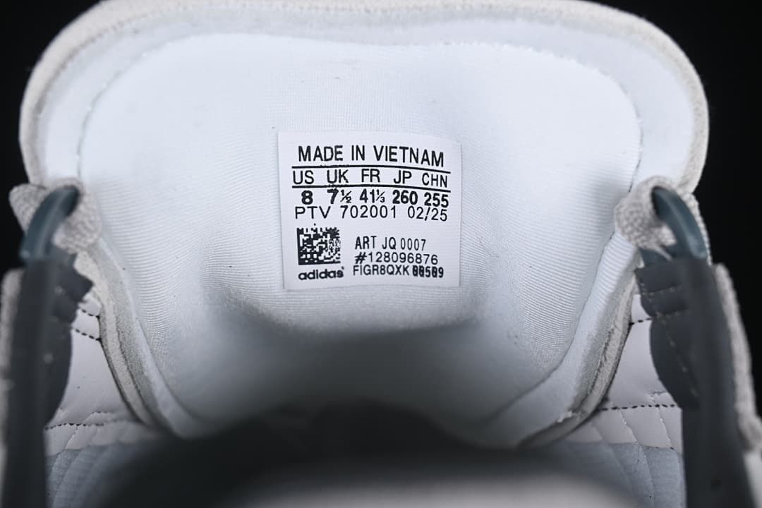 Inside shoe label showing US 8, model JQ0007, and other size markings