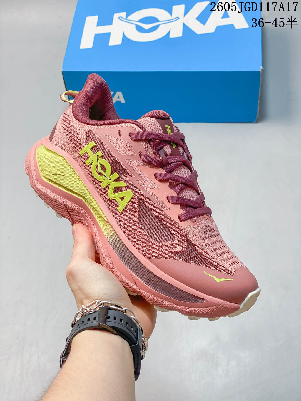 Rose and burgundy Hoka Mafate Speed 2 shoe with bright yellow-green accents.