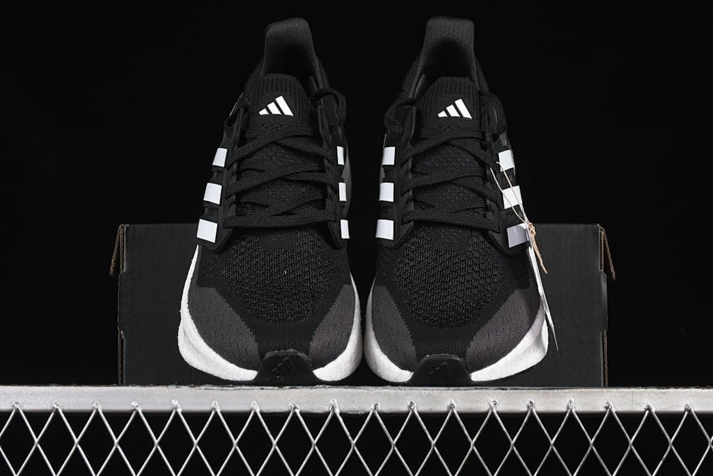 Front view of the pair of black Adidas Ultraboost 5 shoes
