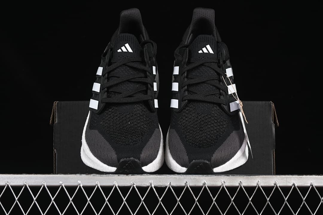 Front view of the pair of black Adidas Ultraboost 5 shoes