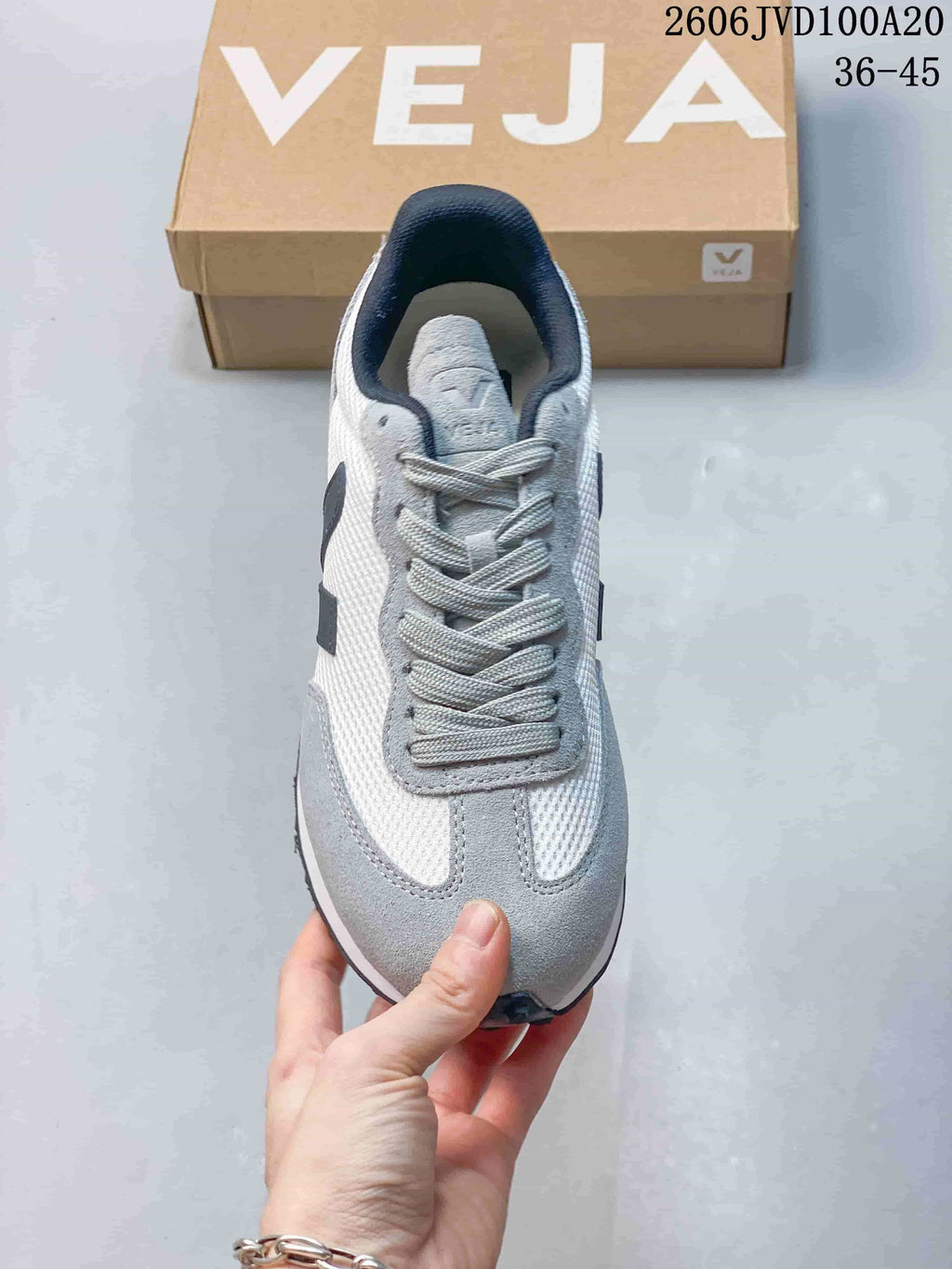 Top view of the lace-up sneaker showing grey overlays and navy collar lining; image overlay reads 36–45.