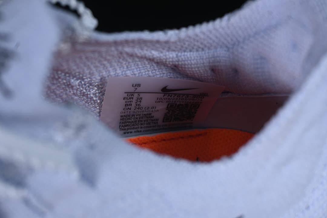 Close-up of the shoe size label showing US 7, UK 5, EU 38, and CM 24.