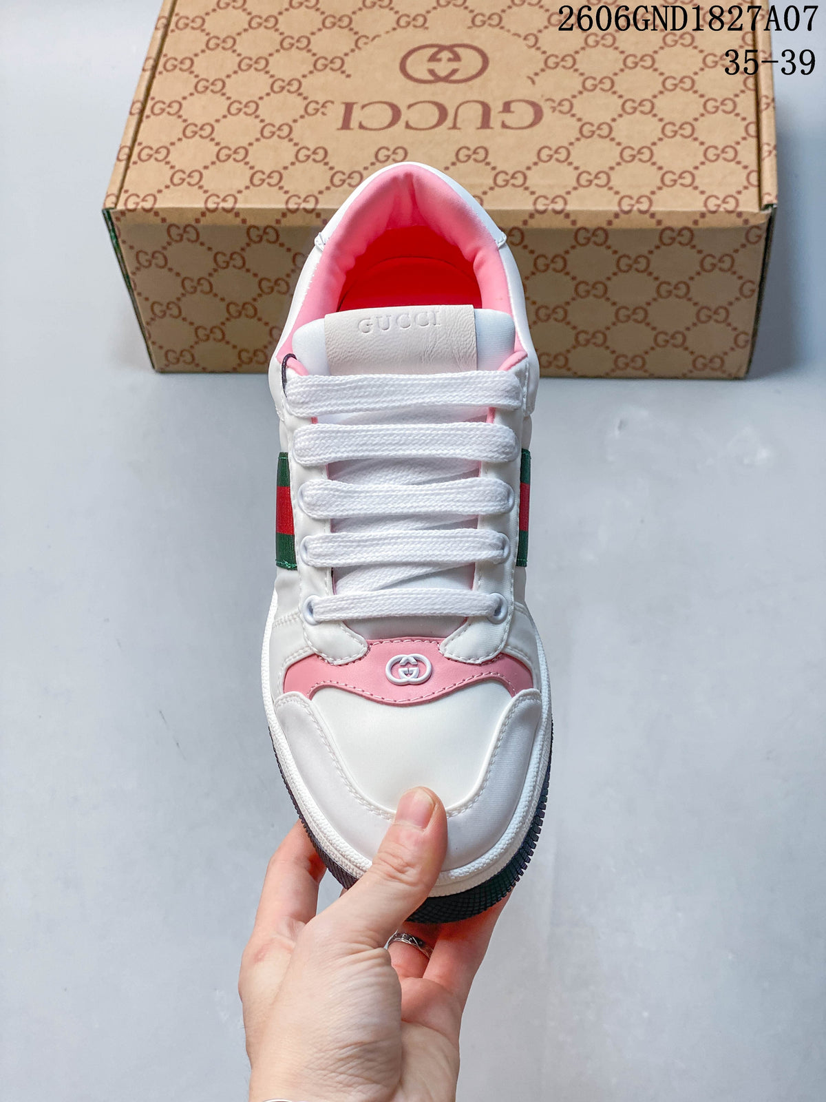 Top view showing the laces, pink accents, and padded collar.