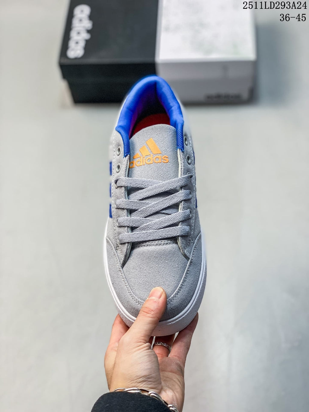 Front view of a gray lace-up sneaker with blue collar lining