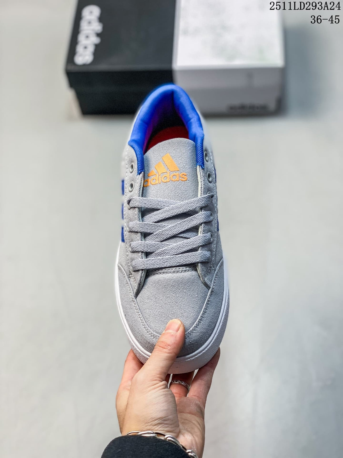Front view of a gray lace-up sneaker with blue collar lining