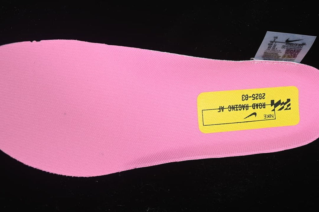 Pink shoe insole with a yellow label