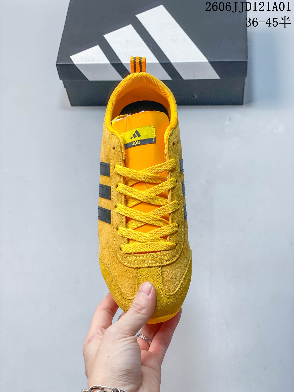 Top view of the yellow lace-up sneaker with black side stripes