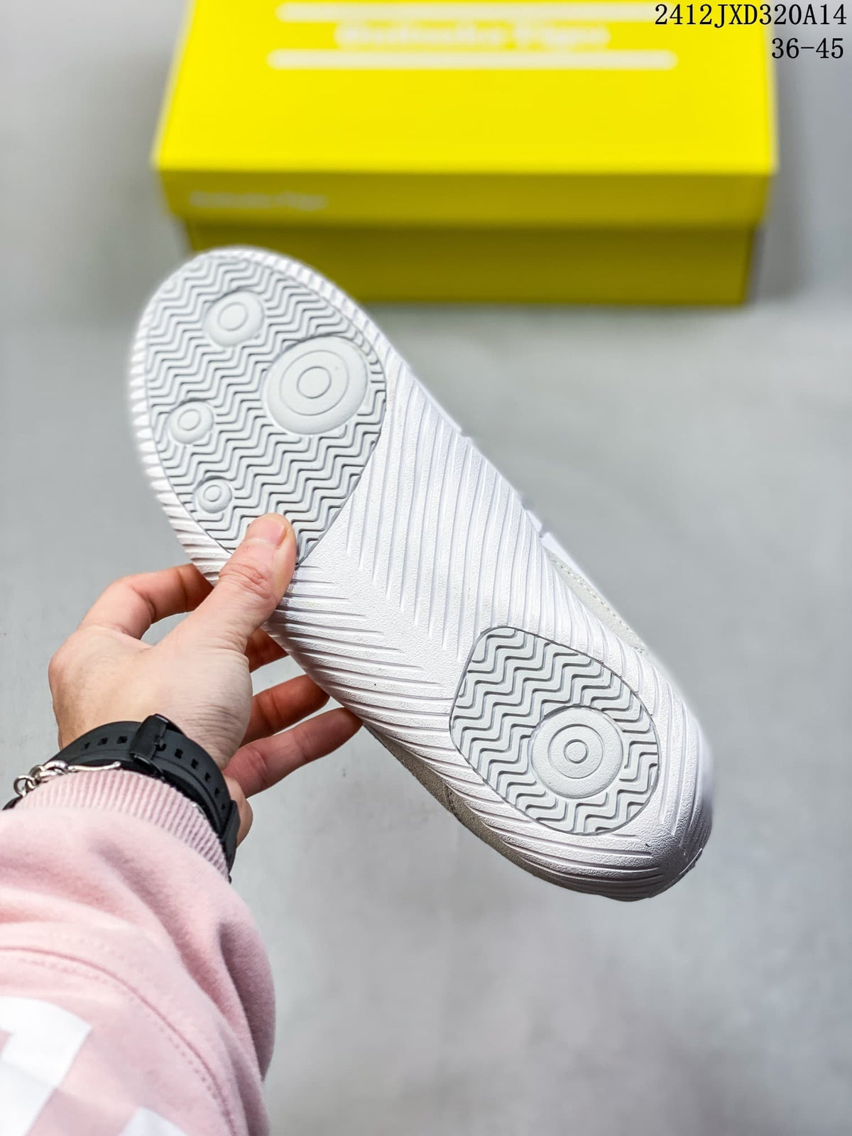 Close-up of the sneaker outsole with circular and wavy tread patterns