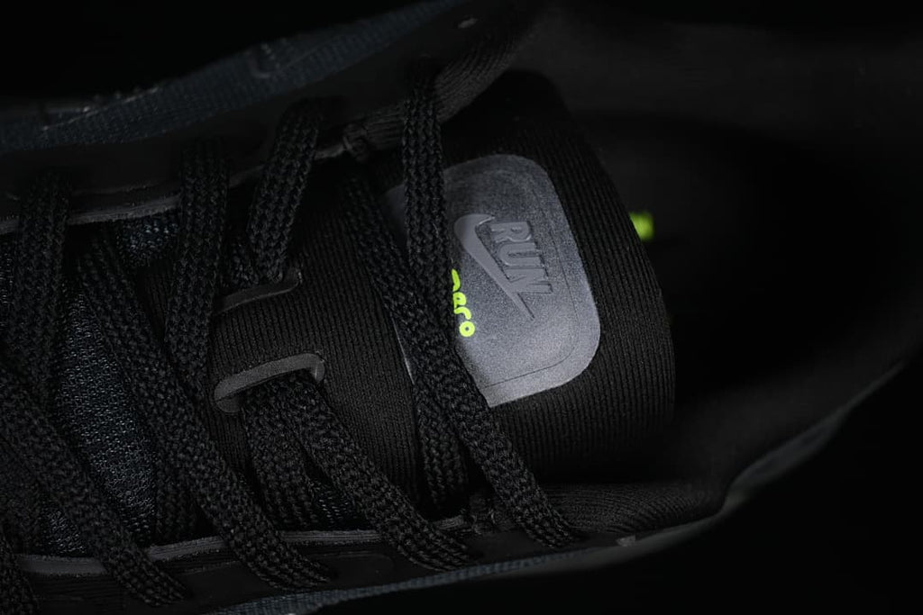 Close-up of the shoe tongue and black laces.