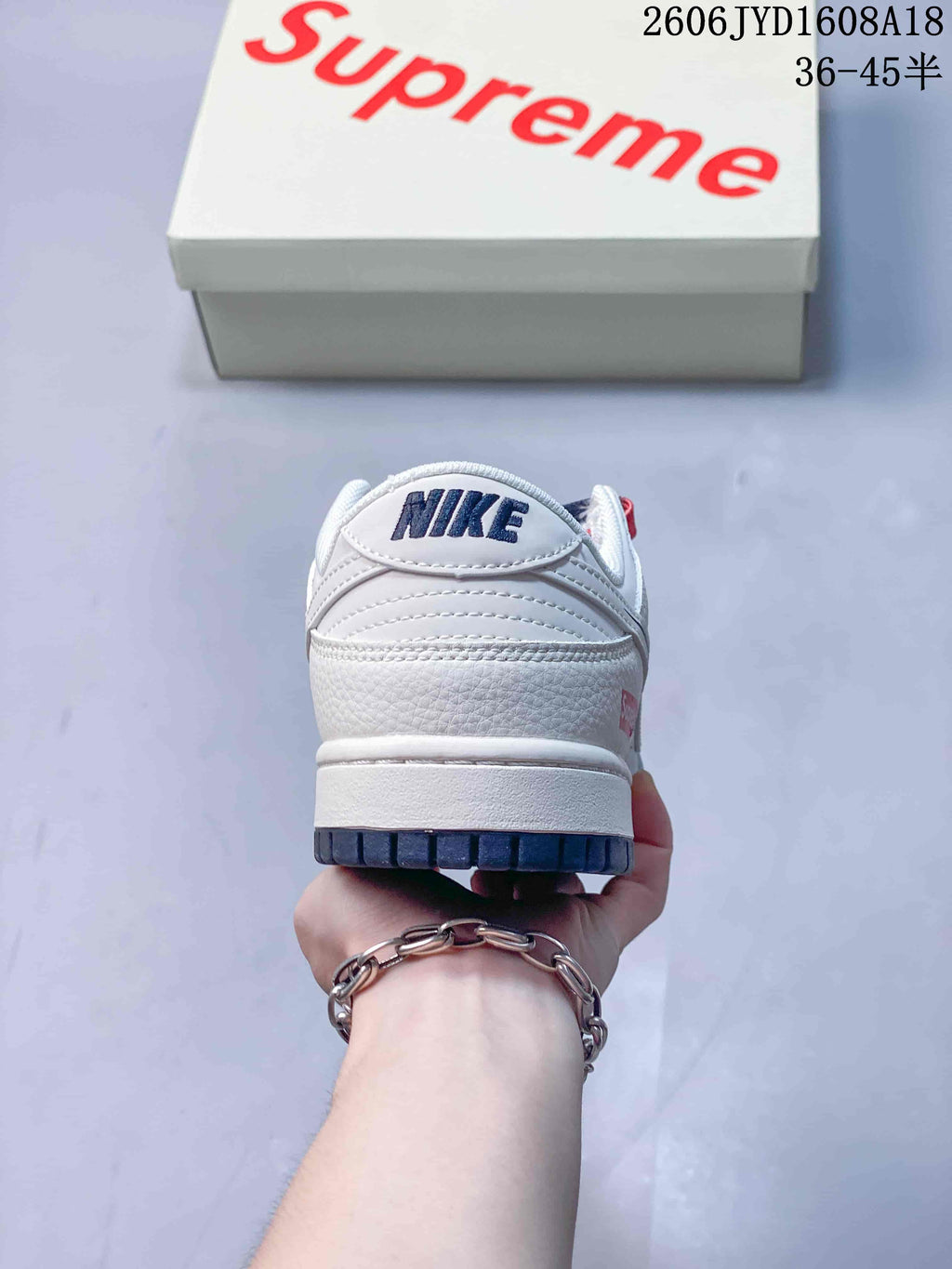 Rear view of the sneaker showing Nike branding and a navy outsole section.