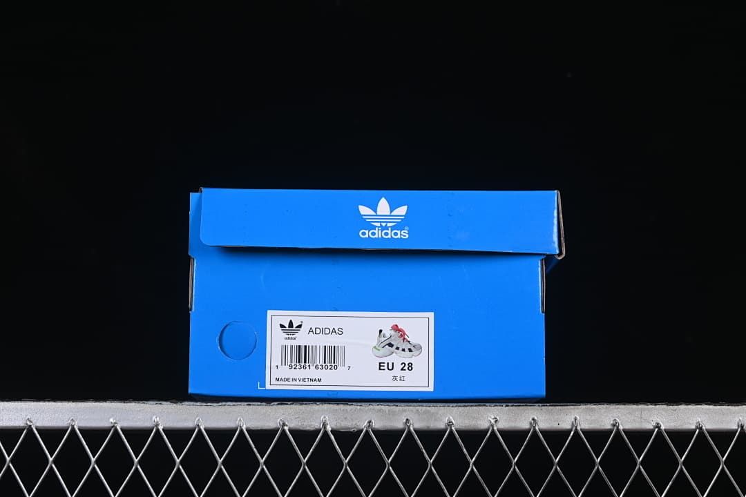 Blue Adidas shoe box with a label showing EU 28.
