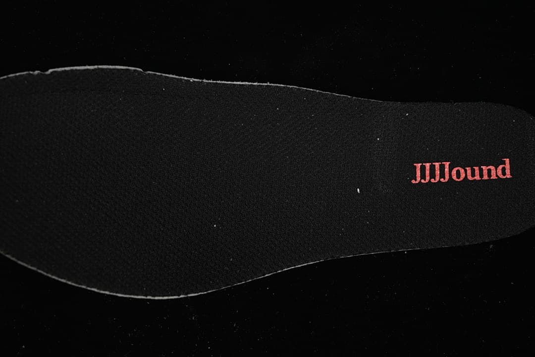 Black shoe insert with red JJJJound lettering