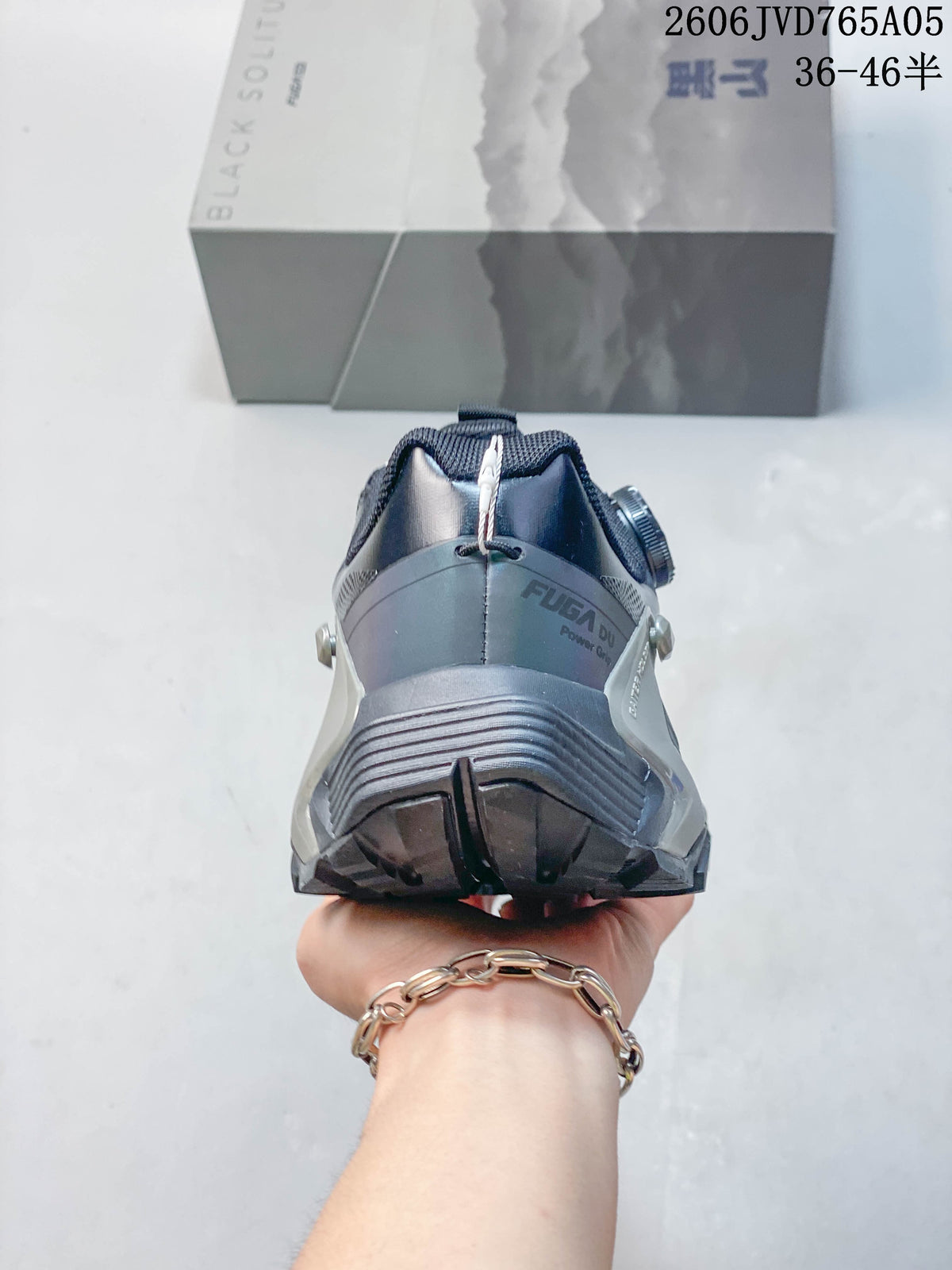 Rear view of a dark gray trail shoe showing its structured heel and support elements.