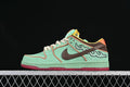 Side view of mint green Nike SB Dunk Low sneakers with brown, coral, yellow, and red accents.