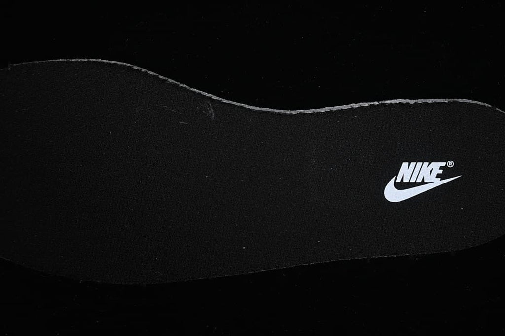 Close-up of a black insole with a Nike logo