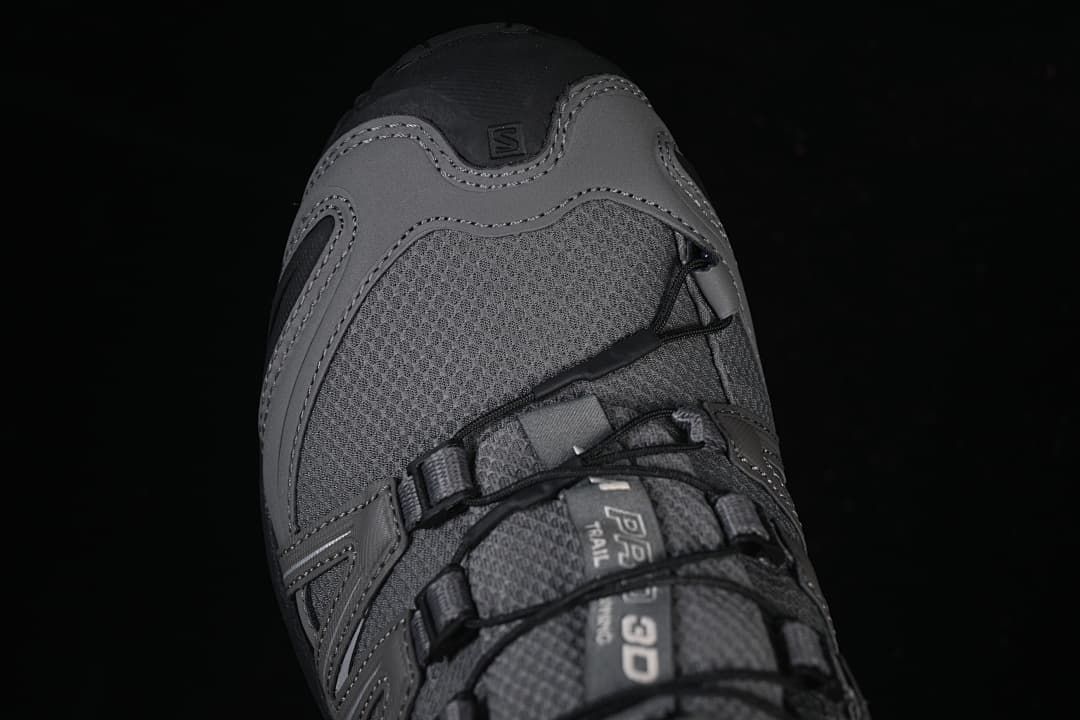 Top-down close-up of the shoe toe and quick-lace system.
