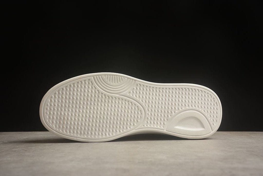 Underside view showing the textured sneaker outsole