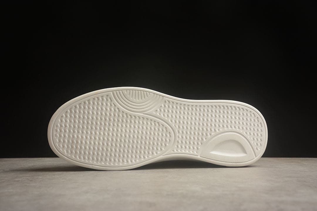 Underside view showing the textured sneaker outsole