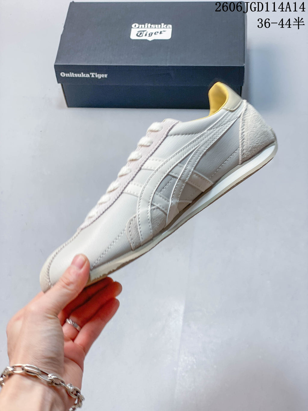 Side profile of a light-colored Onitsuka Tiger Runspark sneaker