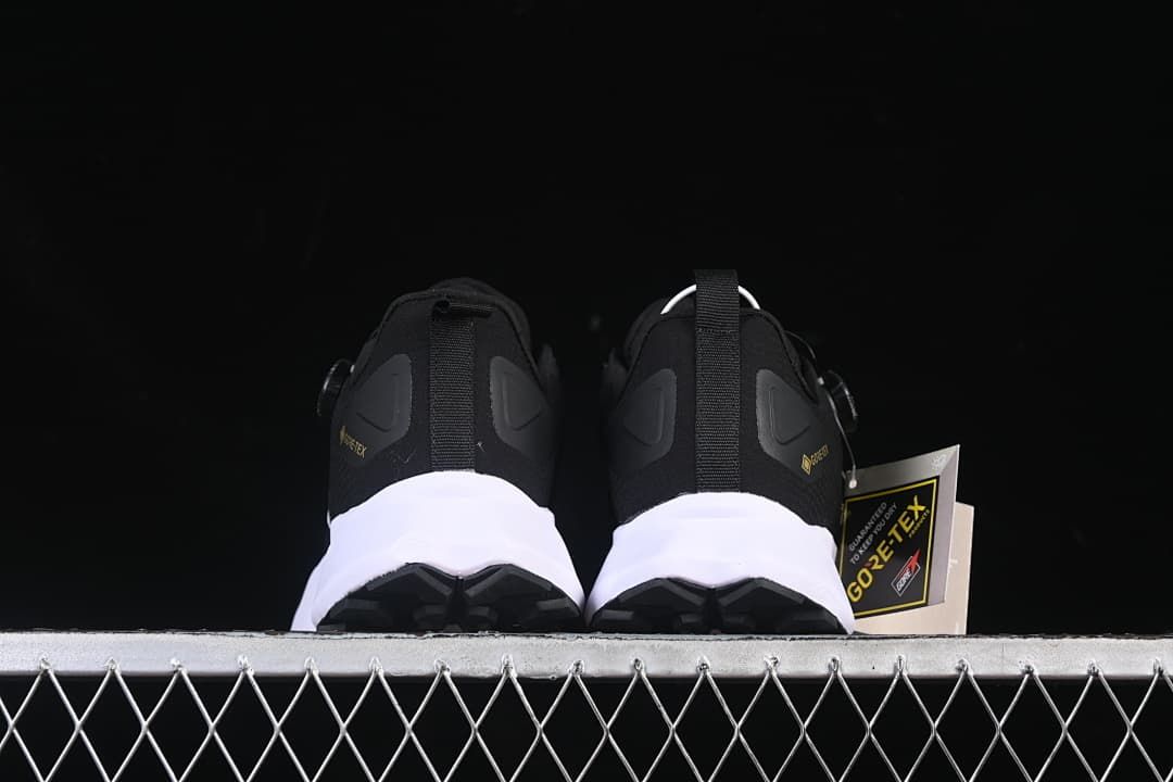 Rear view of both shoes showing the heel design and outsole edges.