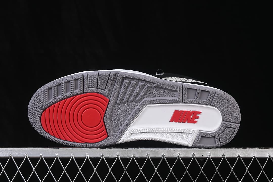 Underside view showing the grey, white and red outsole